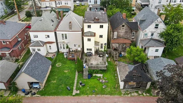 a view of a house with a garden and plants