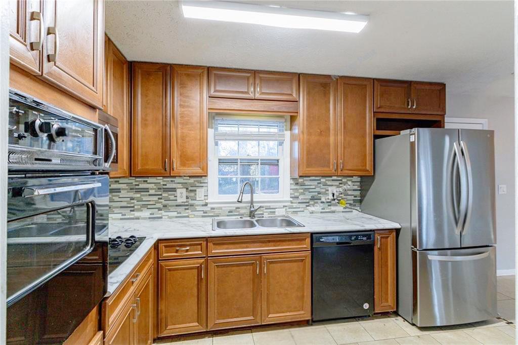 392 Harmony Grove Road Lilburn, GA 30047 - Photo 7 of 25