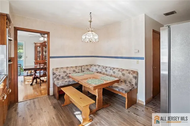 a bedroom with furniture and wooden floor