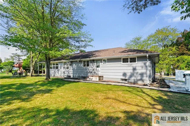 a view of a house with a swimming pool and a chairs