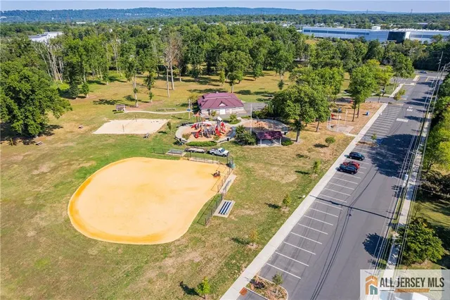 swimming pool view with sitting space and garden view