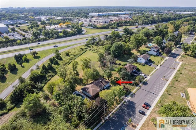 an aerial view of lake and residential houses