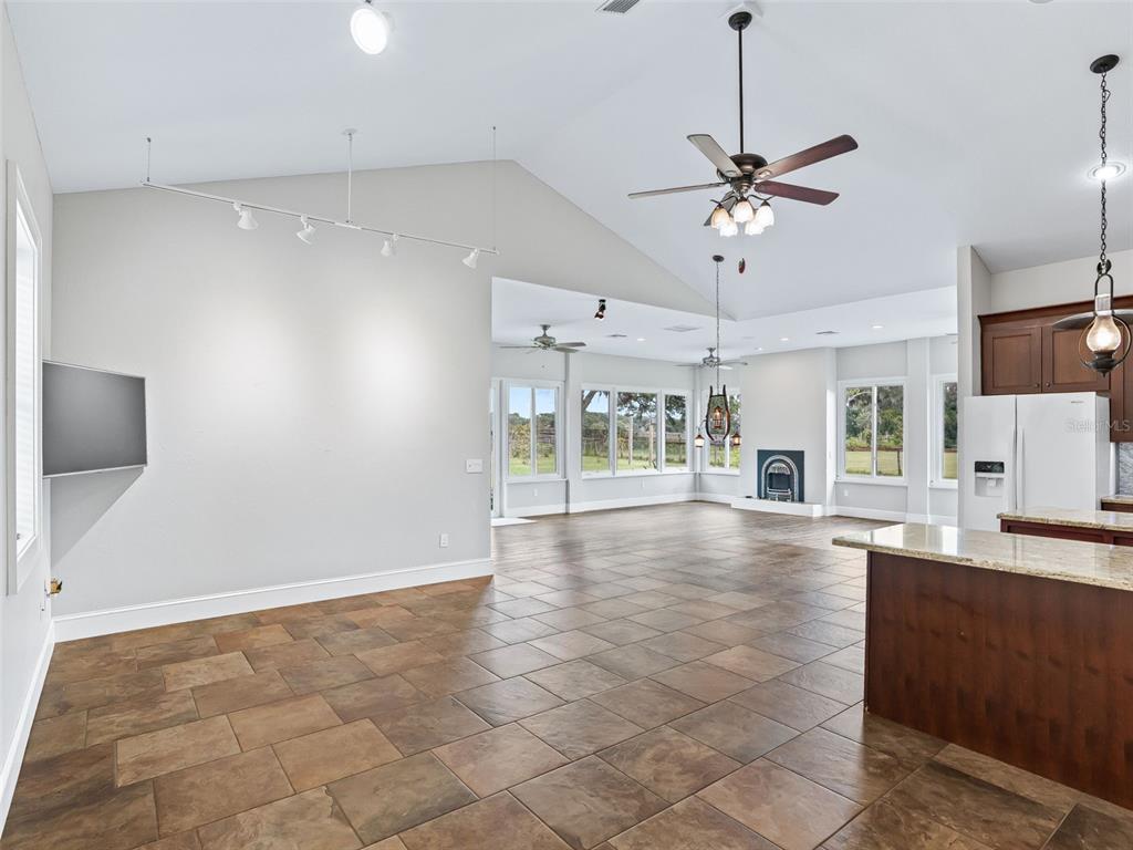 402 Southwest 127th Place Ocala, FL 34473 - Photo 15 of 75 a view of an empty room with a window and kitchen view