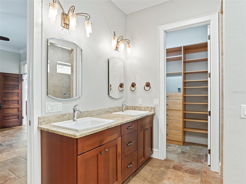 402 Southwest 127th Place Ocala, FL 34473 - Photo 25 of 75 a bathroom with a sink and a mirror