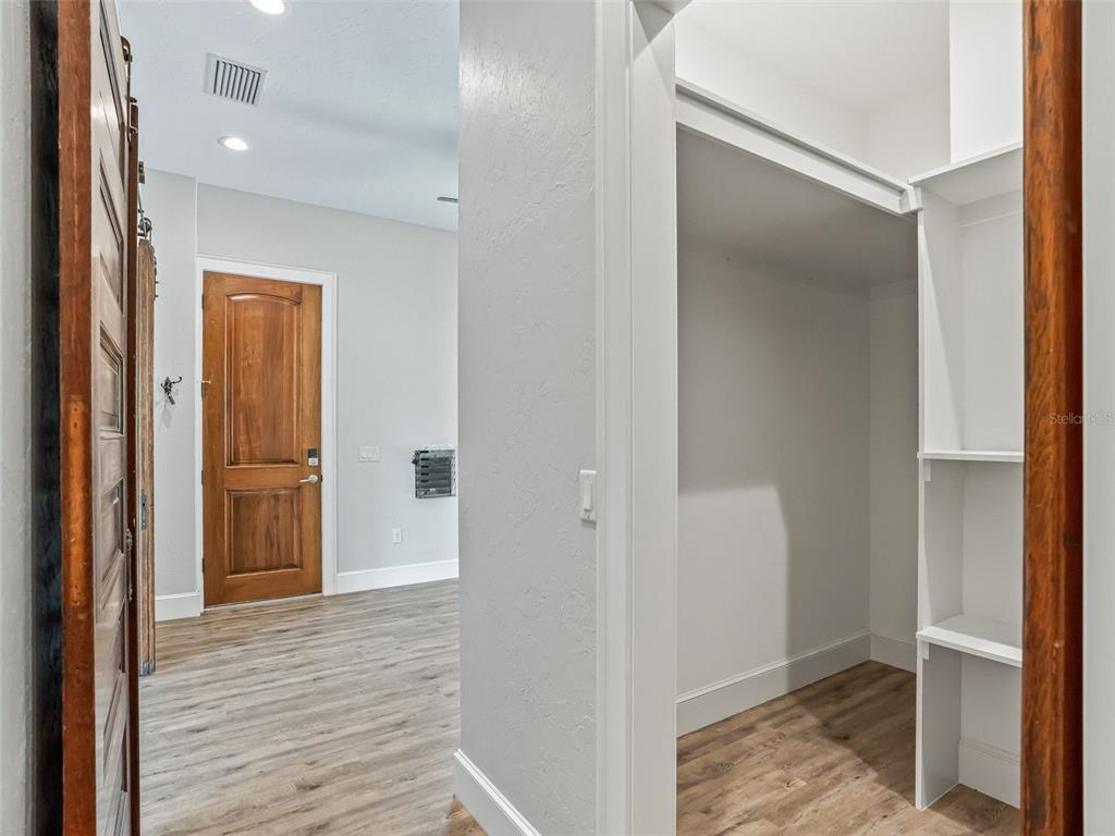 402 Southwest 127th Place Ocala, FL 34473 - Photo 30 of 75 a view of a hallway with wooden floor