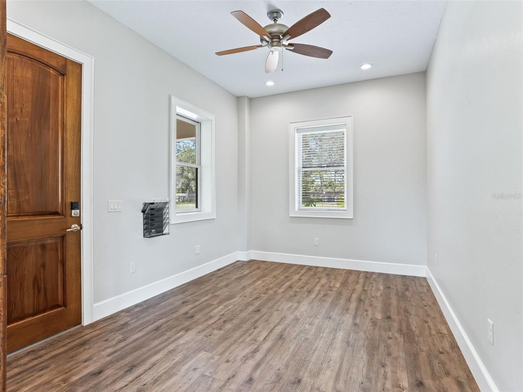 402 Southwest 127th Place Ocala, FL 34473 - Photo 31 of 75 wooden floor in an empty room with a window