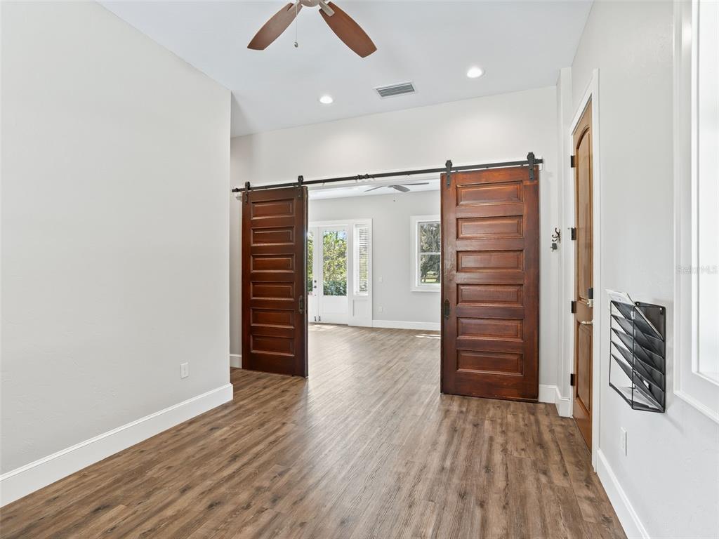 402 Southwest 127th Place Ocala, FL 34473 - Photo 32 of 75 an empty room with wooden floor and closet