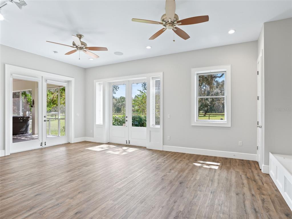 402 Southwest 127th Place Ocala, FL 34473 - Photo 33 of 75 a view of an empty room with wooden floor and a window