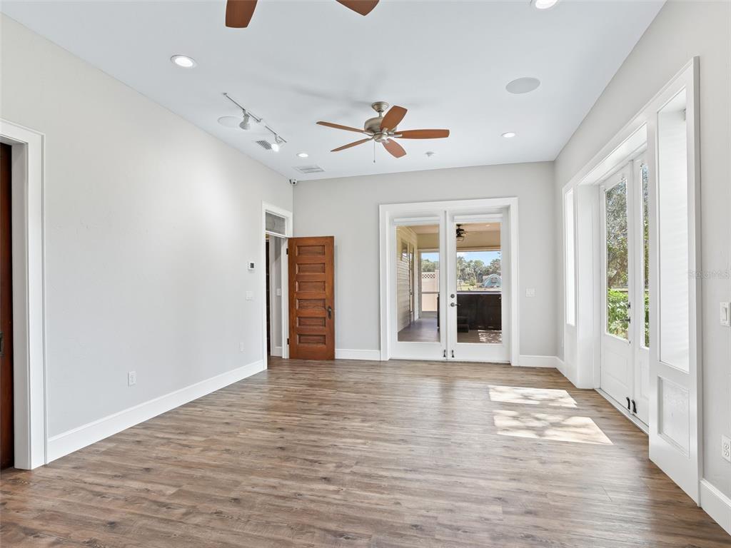 402 Southwest 127th Place Ocala, FL 34473 - Photo 34 of 75 a view of an empty room with window and wooden floor