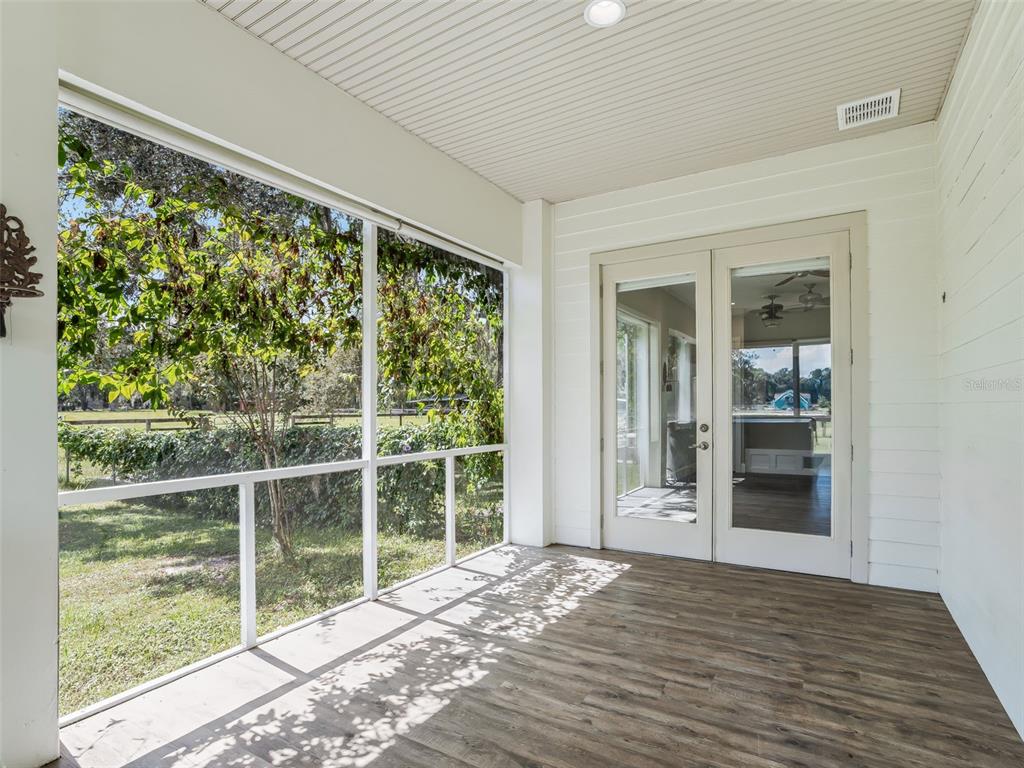 402 Southwest 127th Place Ocala, FL 34473 - Photo 39 of 75 a view of an empty room with wooden floor and a window