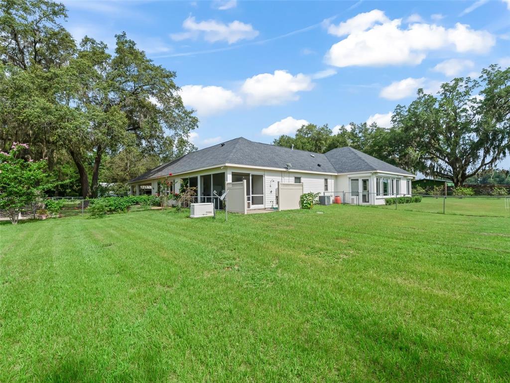 402 Southwest 127th Place Ocala, FL 34473 - Photo 42 of 75 a aerial view of a house with yard and green space
