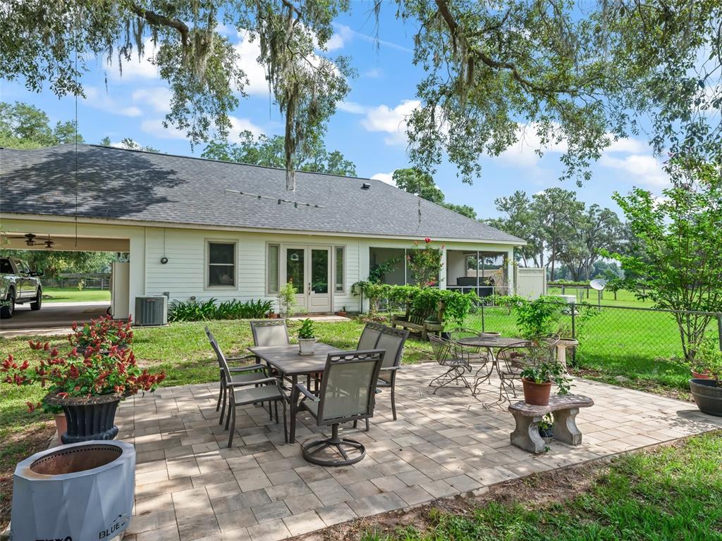 402 Southwest 127th Place Ocala, FL 34473 - Photo 43 of 75 a view of a house with backyard sitting area and garden
