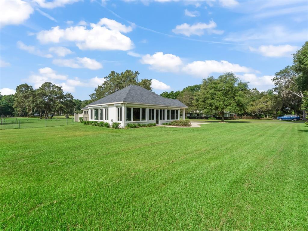 402 Southwest 127th Place Ocala, FL 34473 - Photo 44 of 75 a view of a house with a big yard