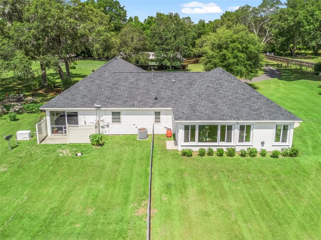 402 Southwest 127th Place Ocala, FL 34473 - Photo 45 of 75 a aerial view of a house with a yard table and chairs