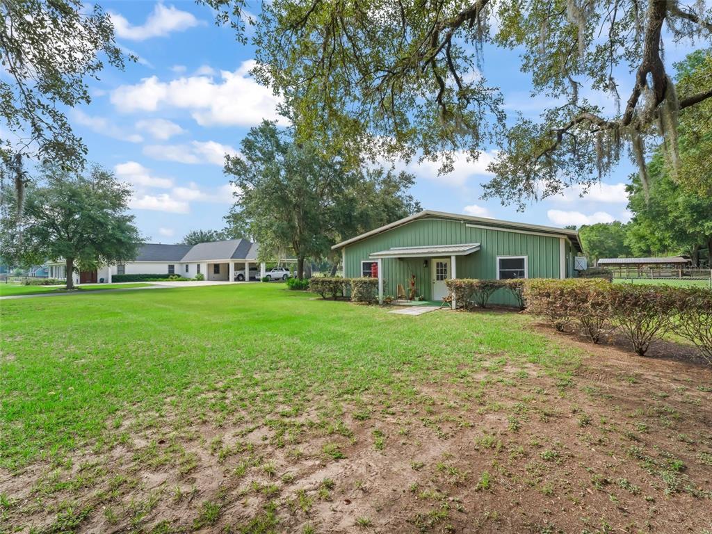 402 Southwest 127th Place Ocala, FL 34473 - Photo 47 of 75 a front view of a house with yard and green space