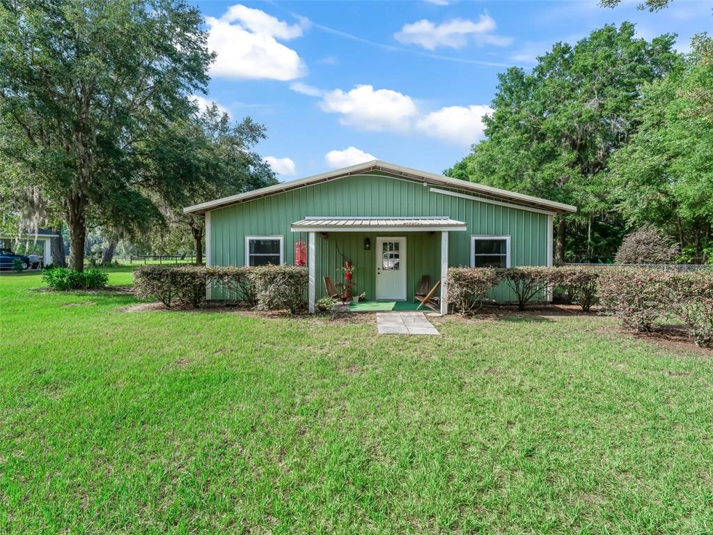 402 Southwest 127th Place Ocala, FL 34473 - Photo 48 of 75 a front view of house with yard and green space