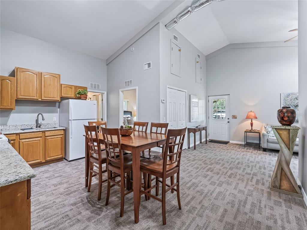 402 Southwest 127th Place Ocala, FL 34473 - Photo 53 of 75 a view of a dining room with furniture and wooden floor