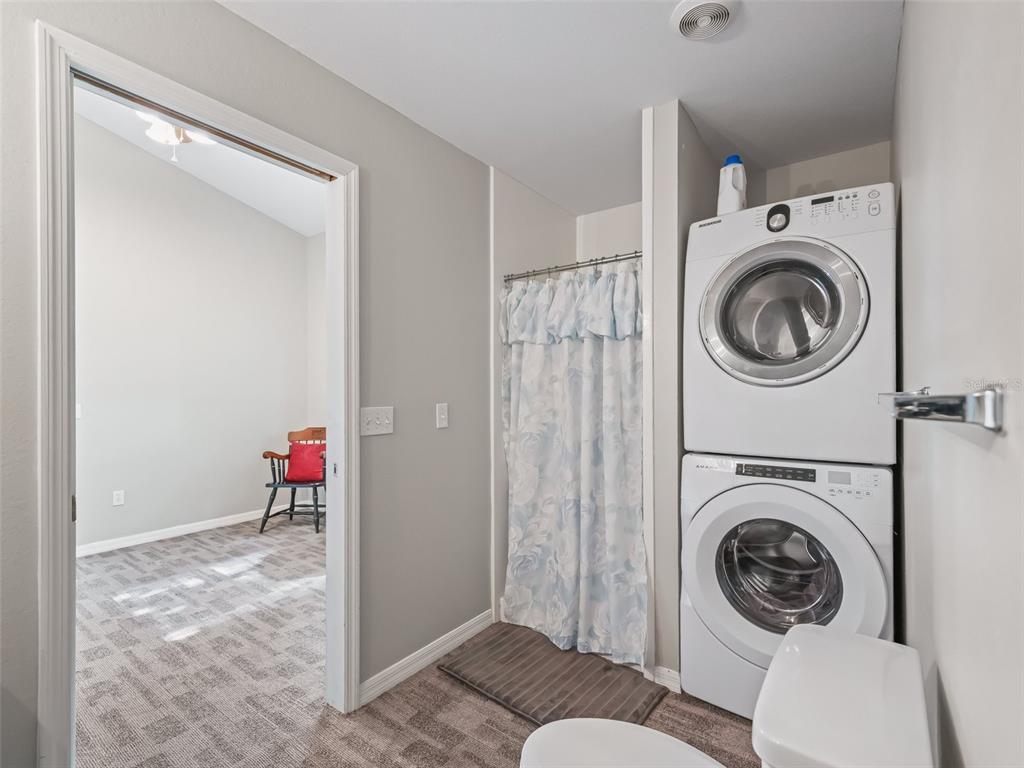402 Southwest 127th Place Ocala, FL 34473 - Photo 61 of 75 a view of a storage & utility room with washer and dryer
