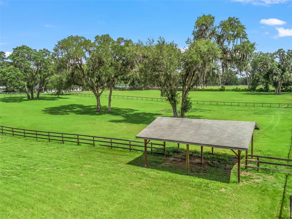 402 Southwest 127th Place Ocala, FL 34473 - Photo 72 of 75 a view of a table and chairs in the garden