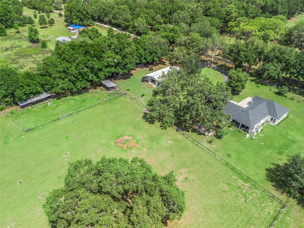 402 Southwest 127th Place Ocala, FL 34473 - Photo 74 of 75 an aerial view of residential house with outdoor space and trees all around