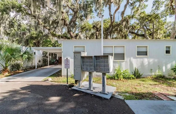 a view of backyard with a patio