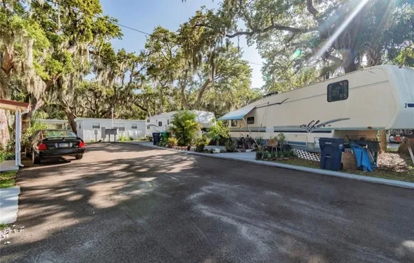 a view of street with parked cars