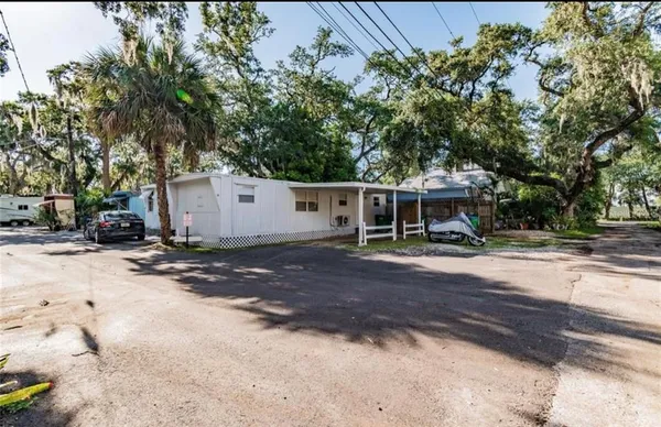 a view of a house with a yard and garage