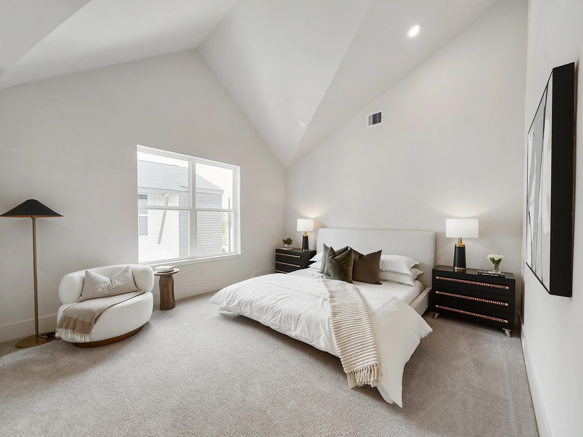 861 Rachel Street, Unit E Houston, TX 77091 - Photo 3 of 29 Experience luxury in this bright, spacious bedroom with soaring ceilings and a large window that bathes the room in natural light.