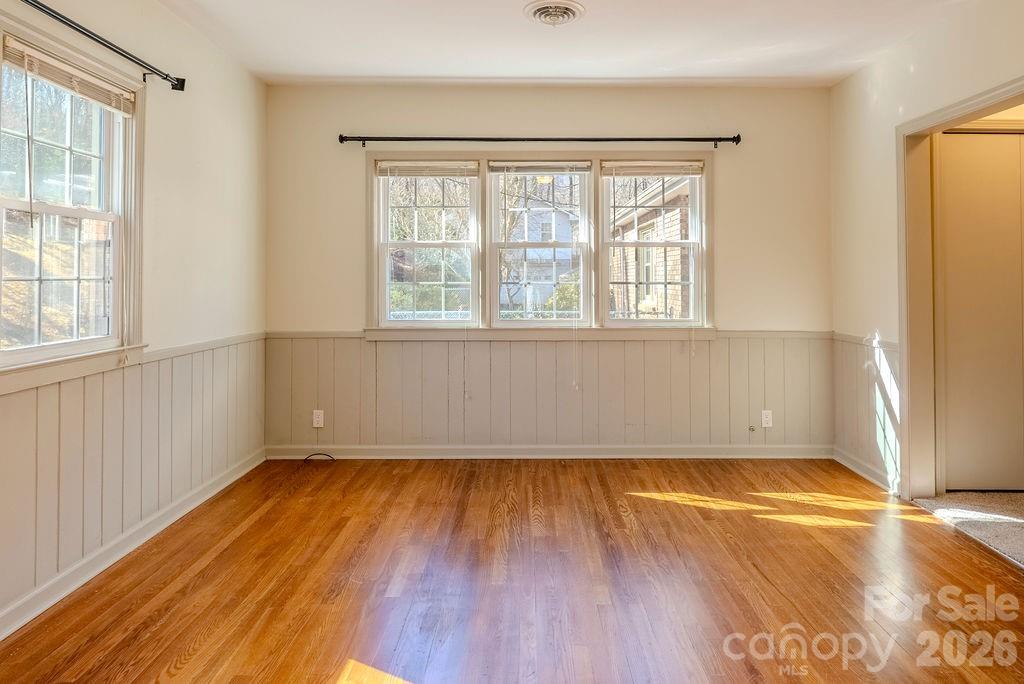 2212 Wayah Road Franklin, NC 28734 - Photo 14 of 47 an empty room with wooden floor and windows