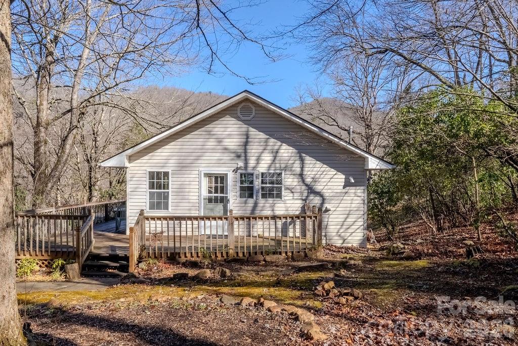 2212 Wayah Road Franklin, NC 28734 - Photo 23 of 47 a view of a house with a small yard and wooden fence