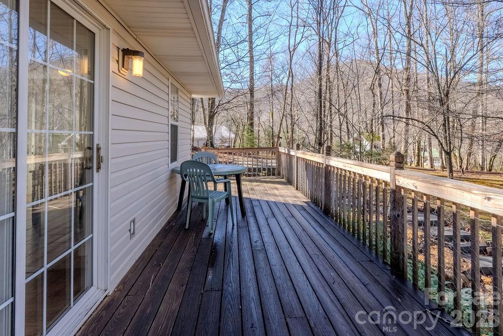 2212 Wayah Road Franklin, NC 28734 - Photo 24 of 47 a balcony with wooden floor and trees