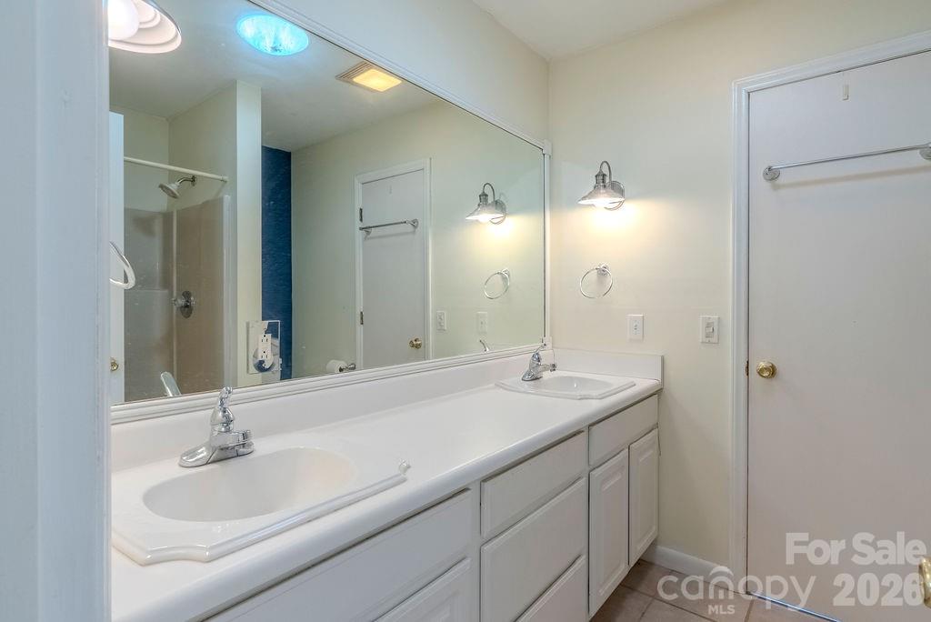 2212 Wayah Road Franklin, NC 28734 - Photo 32 of 47 a bathroom with a sink and a mirror