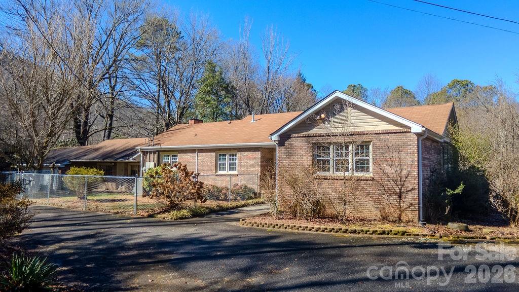 2212 Wayah Road Franklin, NC 28734 - Photo 37 of 47 a front view of a house with garden