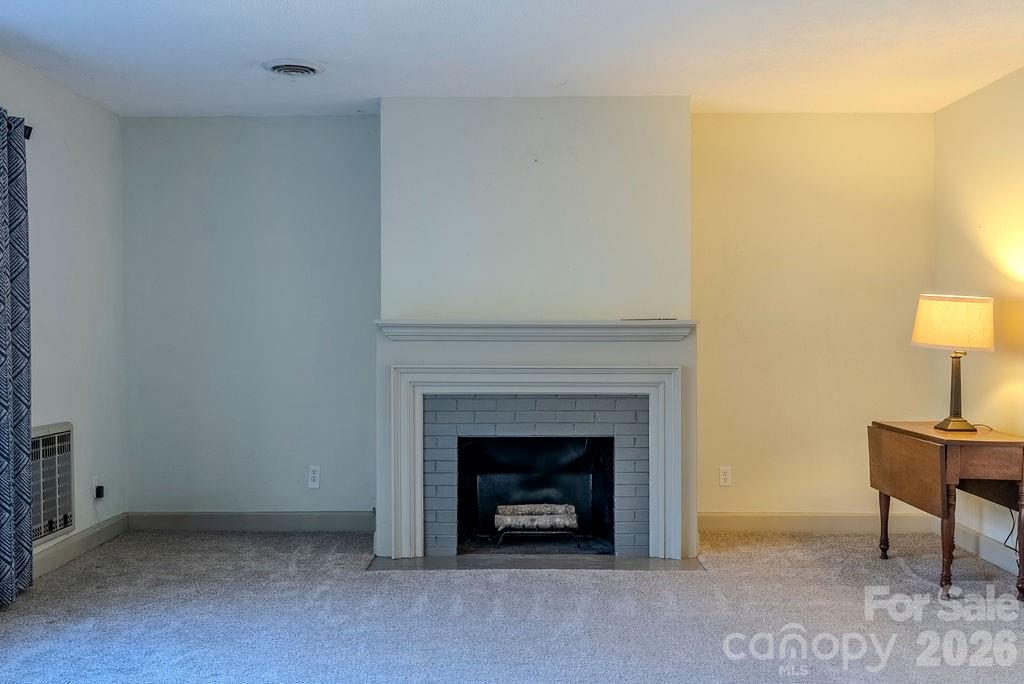 2212 Wayah Road Franklin, NC 28734 - Photo 6 of 47 a living room with furniture and a fireplace