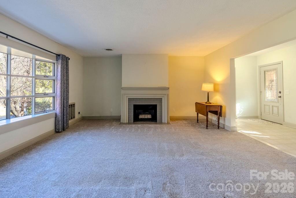 2212 Wayah Road Franklin, NC 28734 - Photo 7 of 47 a view of a livingroom with an empty space and a fireplace