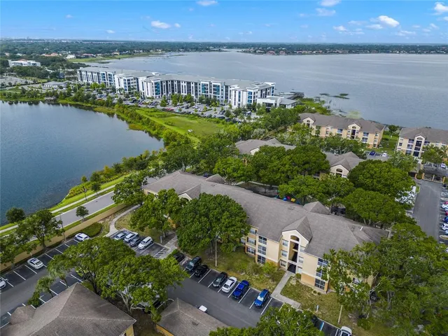 an aerial view of a city with lake view