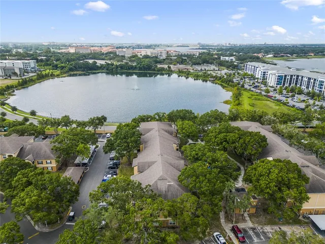 an aerial view of a city with lake view
