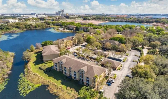 an aerial view of a city and lake view