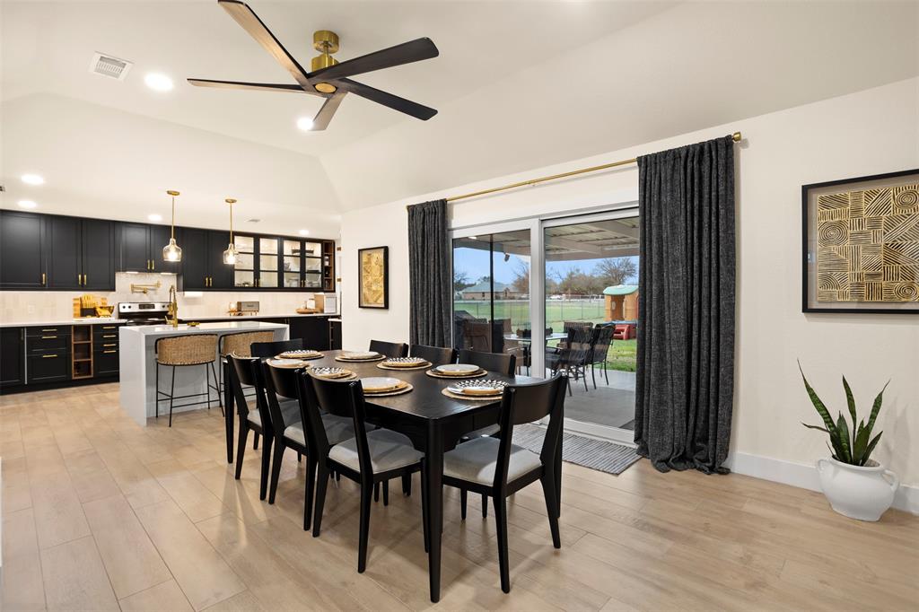1121 Pierce Road Red Oak, TX 75154 - Photo 11 of 40 a dining room with furniture and window