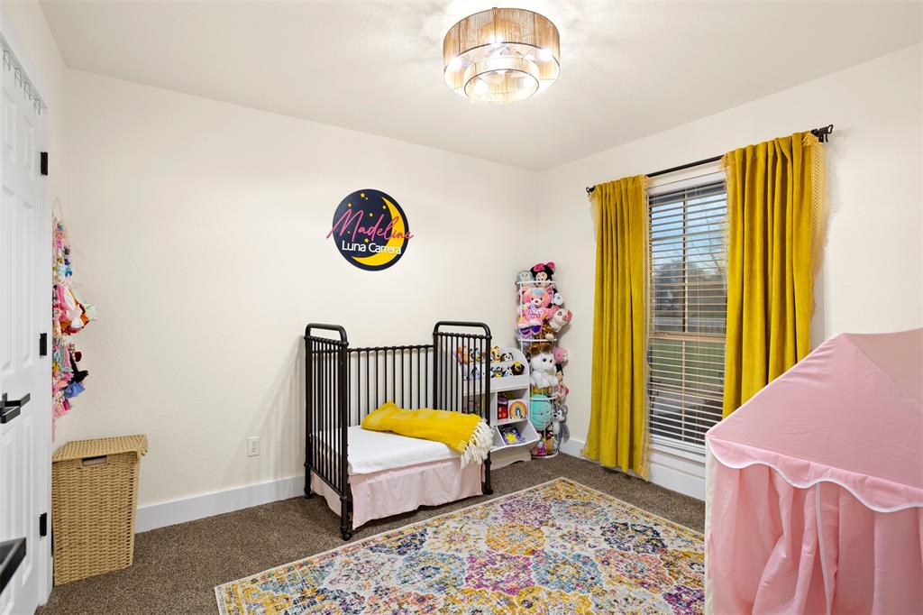 1121 Pierce Road Red Oak, TX 75154 - Photo 24 of 40 a bed room with a bed and a window