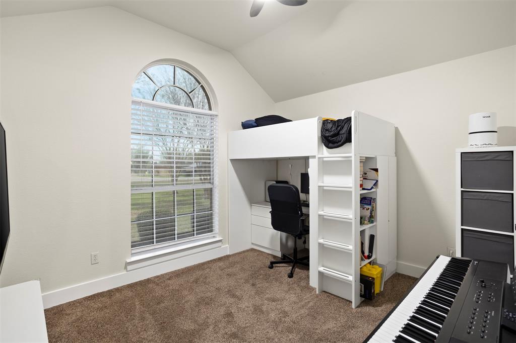 1121 Pierce Road Red Oak, TX 75154 - Photo 26 of 40 a view of an empty room with furniture and staircase