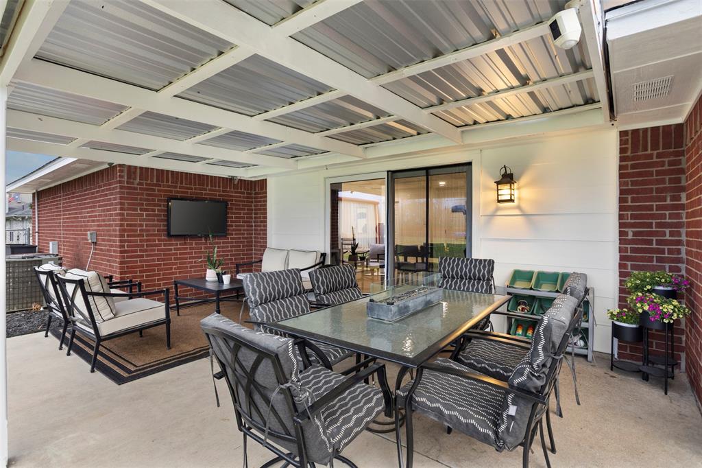 1121 Pierce Road Red Oak, TX 75154 - Photo 29 of 40 a view of a patio with a table and chairs
