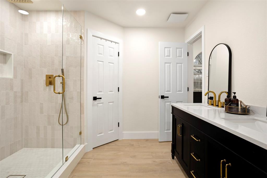 1121 Pierce Road Red Oak, TX 75154 - Photo 3 of 40 a bathroom with a double vanity sink a toilet and shower