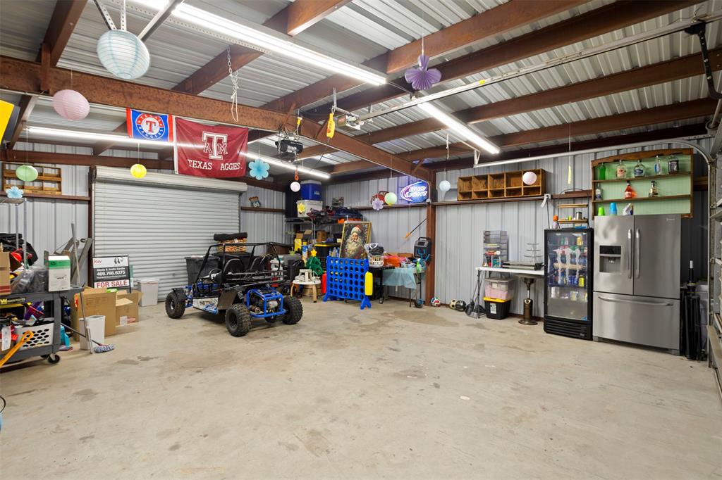 1121 Pierce Road Red Oak, TX 75154 - Photo 34 of 40 a view of a storage room with a lot of stuff