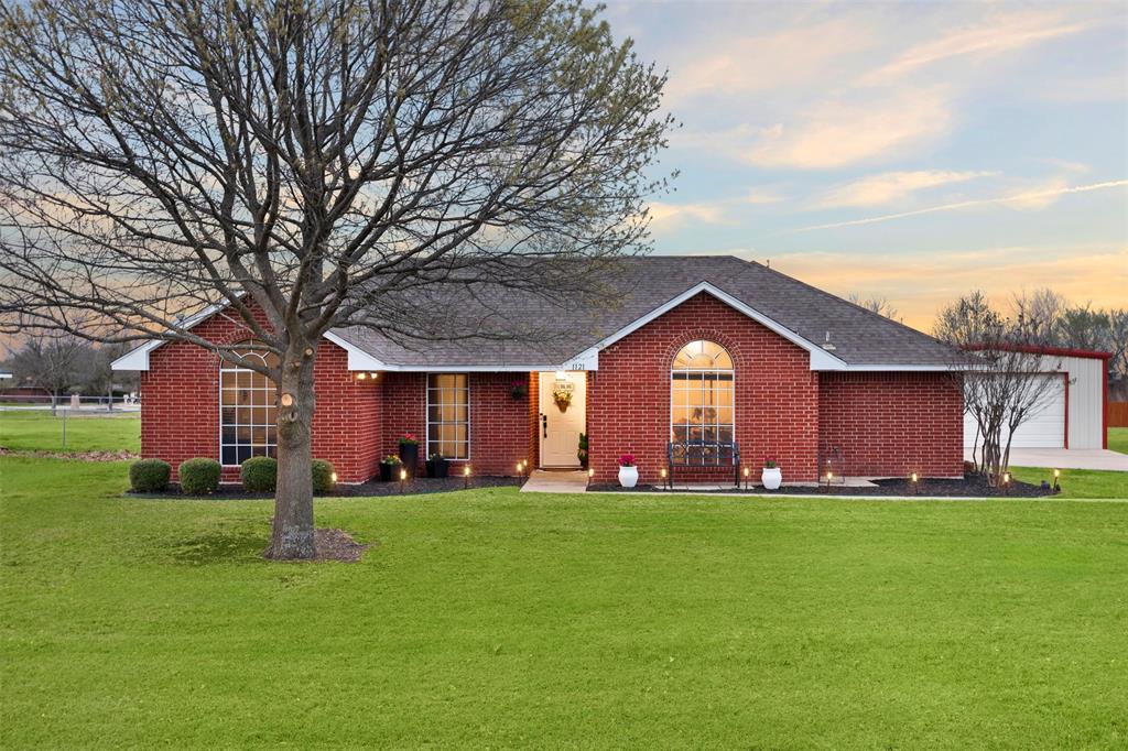 1121 Pierce Road Red Oak, TX 75154 - Photo 40 of 40 a large tree in front of a house with a yard