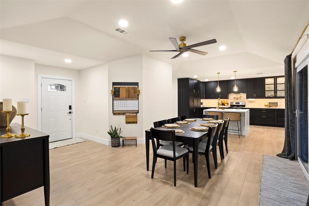 1121 Pierce Road Red Oak, TX 75154 - Photo 9 of 40 a room with stainless steel appliances kitchen island granite countertop furniture and a dining table