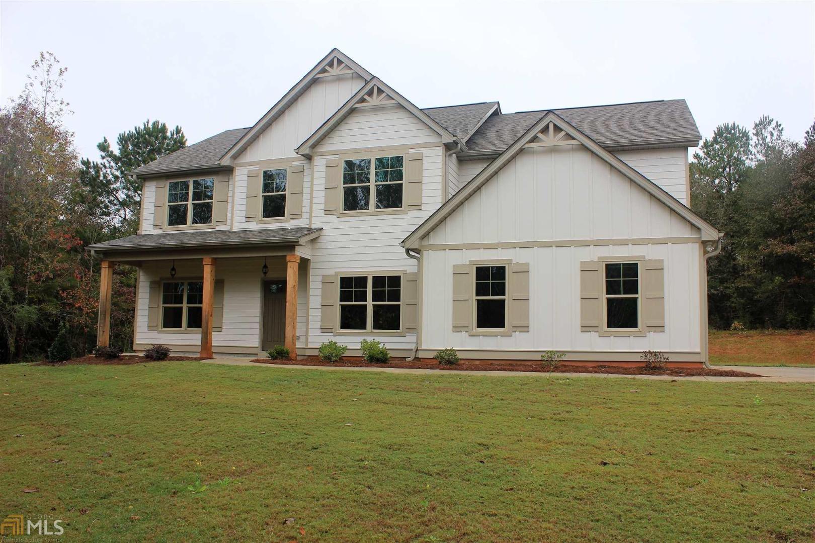 128 Bottoms Road, Unit 3 Concord, GA 30206 - Photo 1 of 1 a front view of a house with a garden