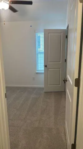 a view of a kitchen from the hallway