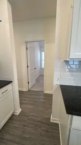 a bathroom with a glass shower door