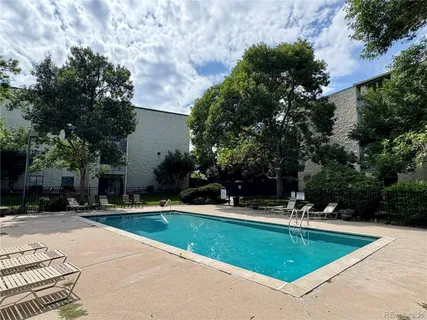 a view of a swimming pool with a patio